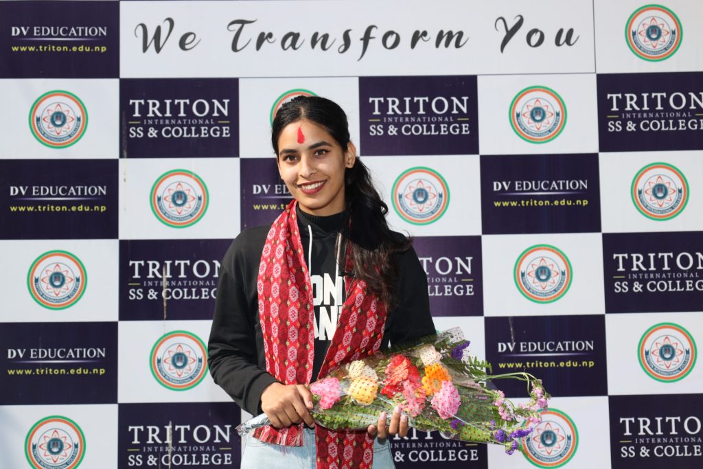 Manita Panta carrying bouquet in tition